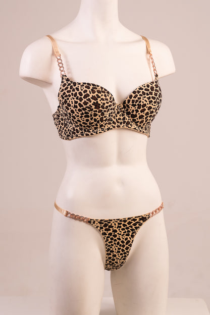 Leopard print bra and panties set on a mannequin against a plain background